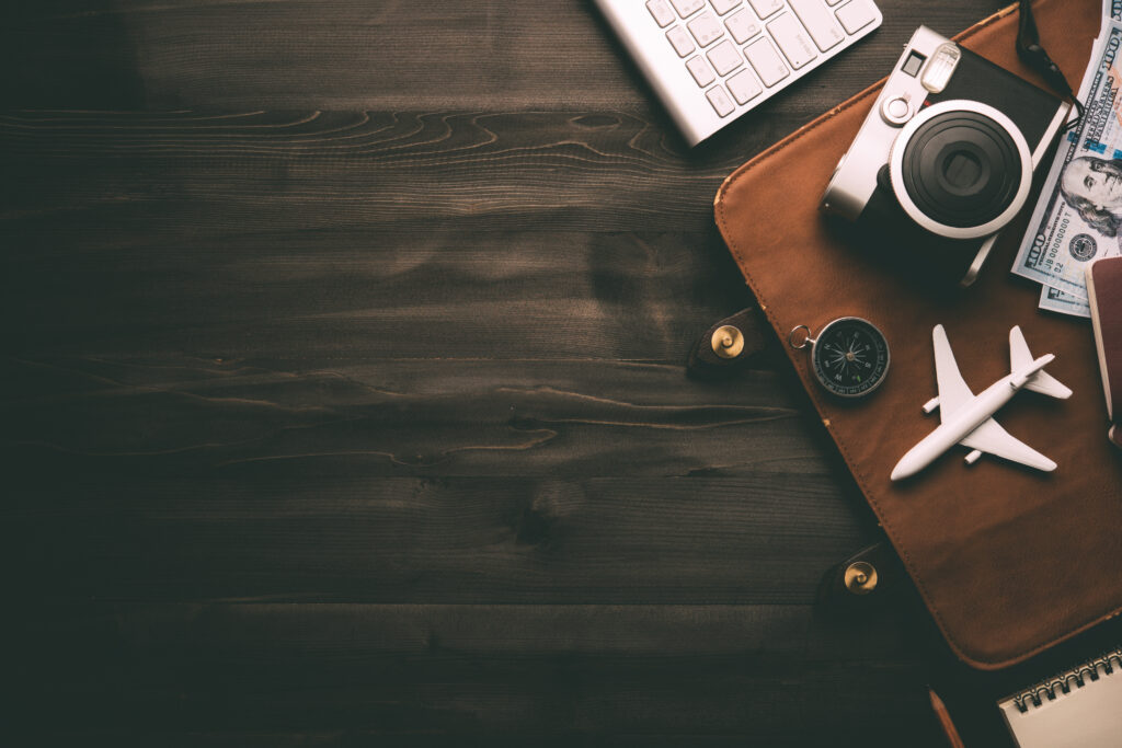 travel accessories and costume on wooden floor,travel concept.coppy space for text or design.